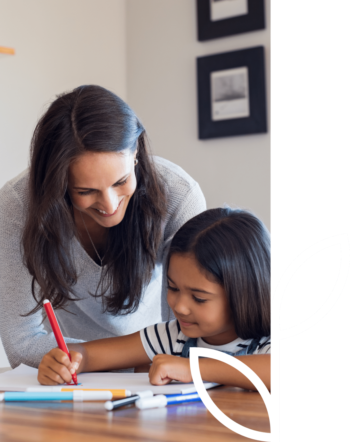 woman helping daughter with homework
