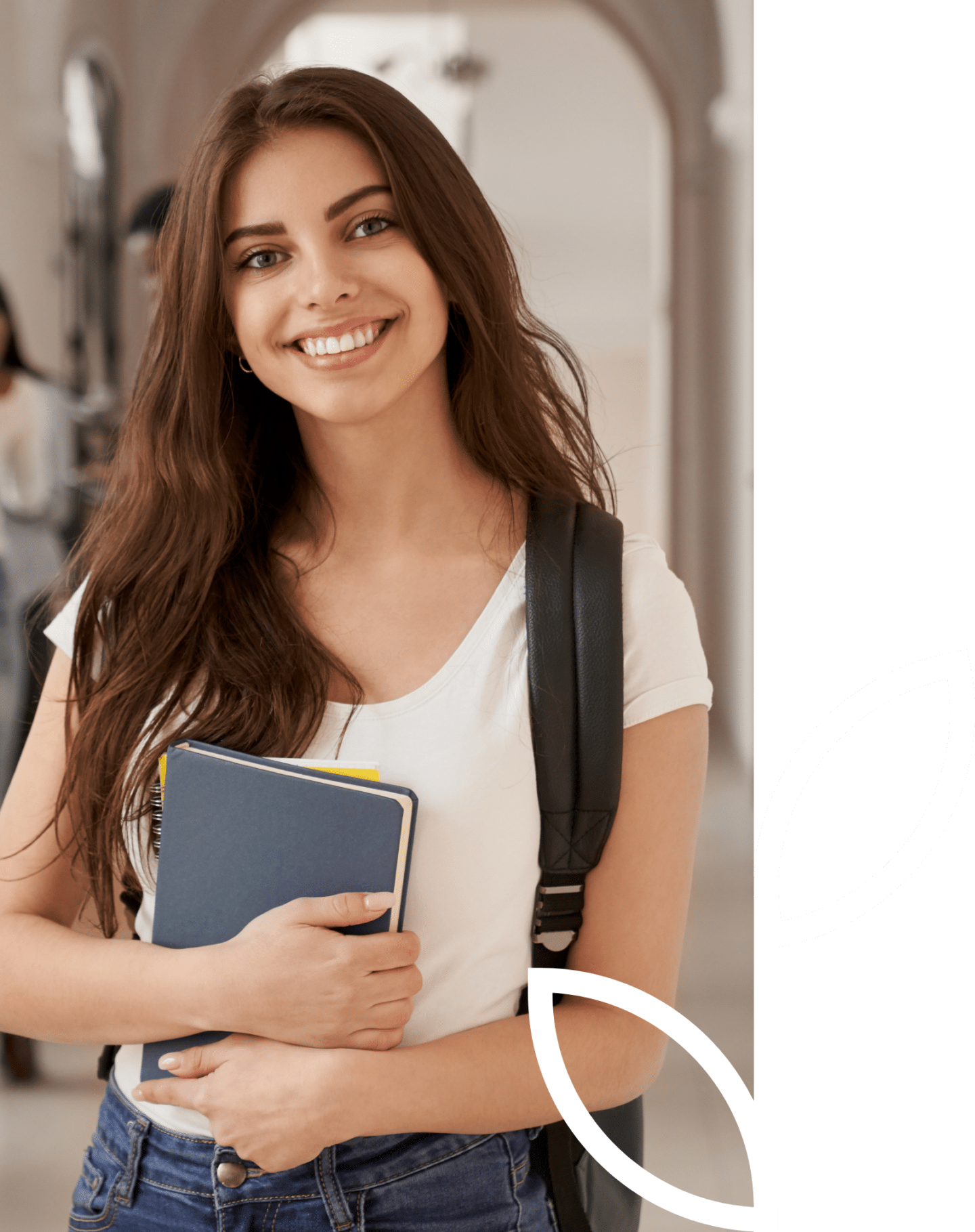 woman holding book and smiling