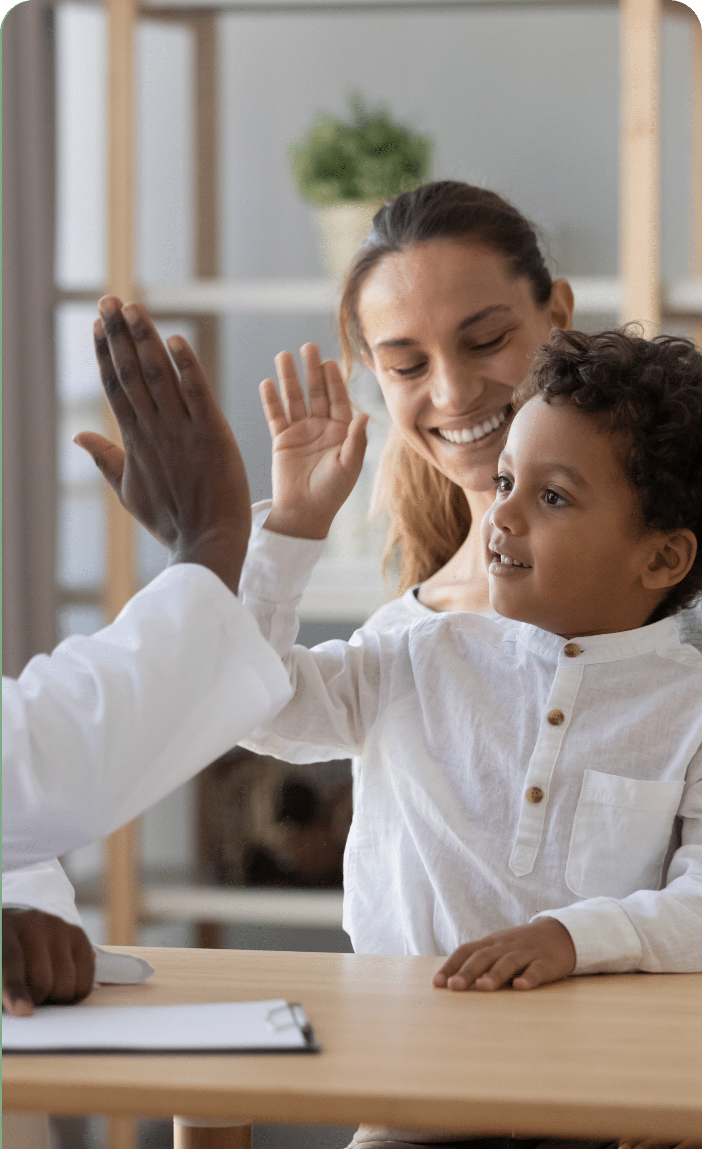 young boy giving high five