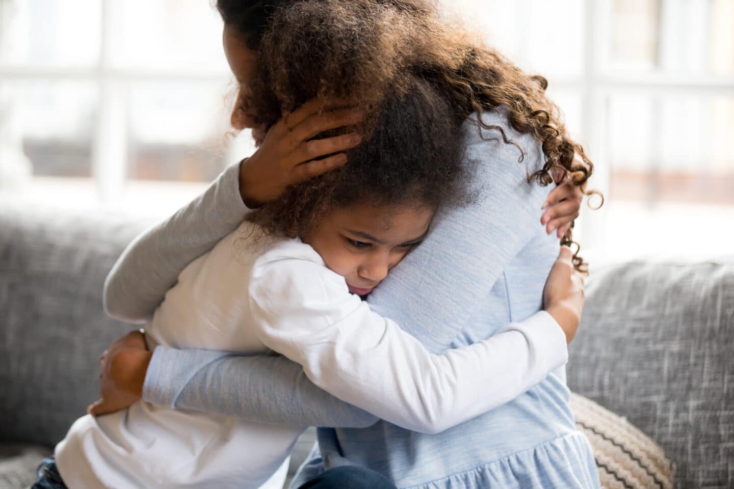 mother holding daughter hug