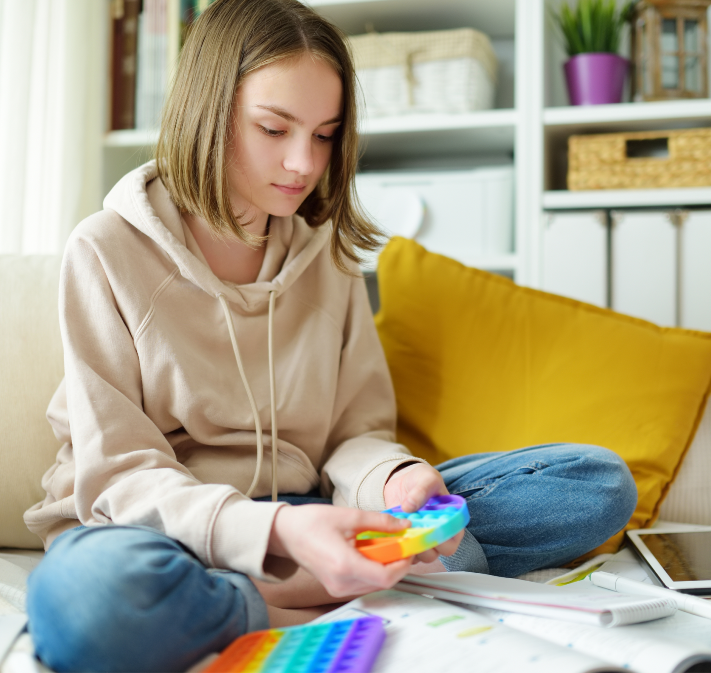 female student doing fidget toy