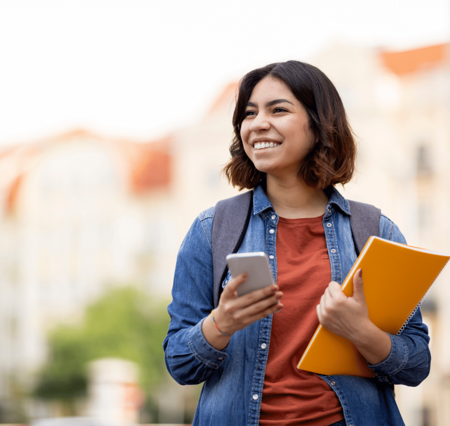 female student with bag and phone