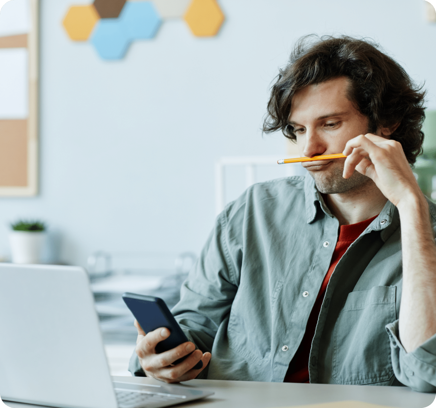 male college student on phone and computer