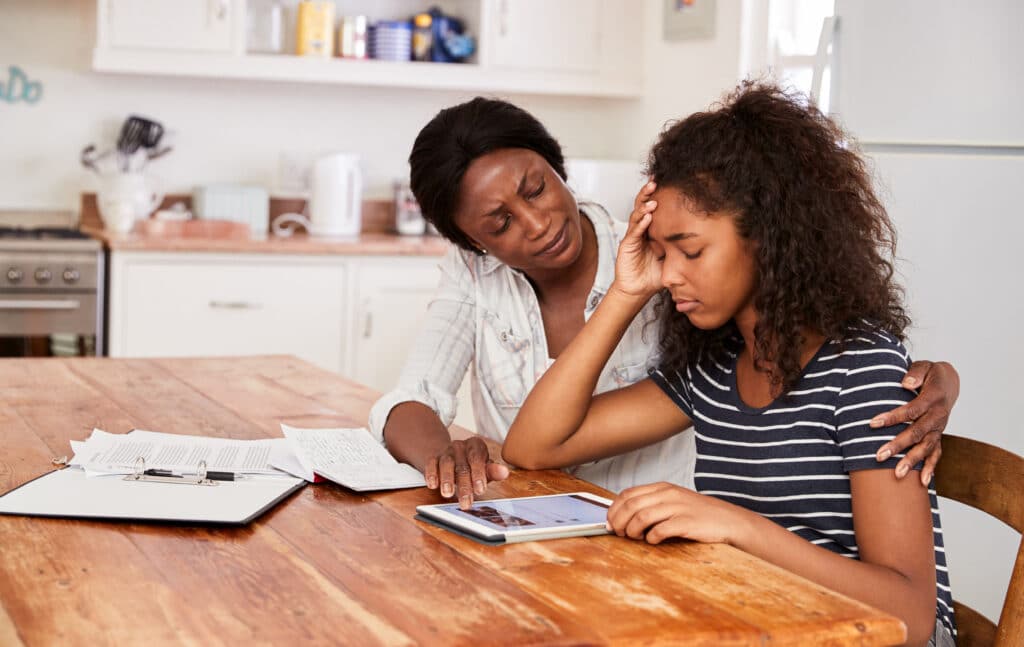 mother helping her student